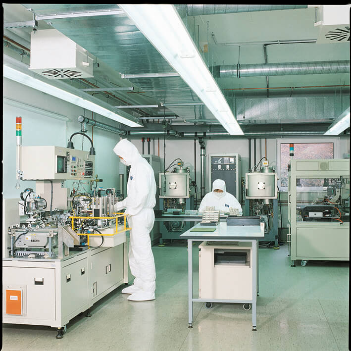 Two people working in an electronics laboratory